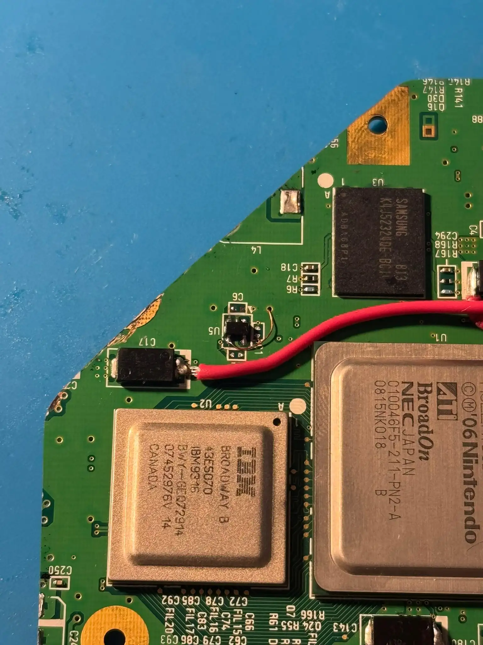 A trimmed Wii motherboard with relocated chips, part of a GWii build